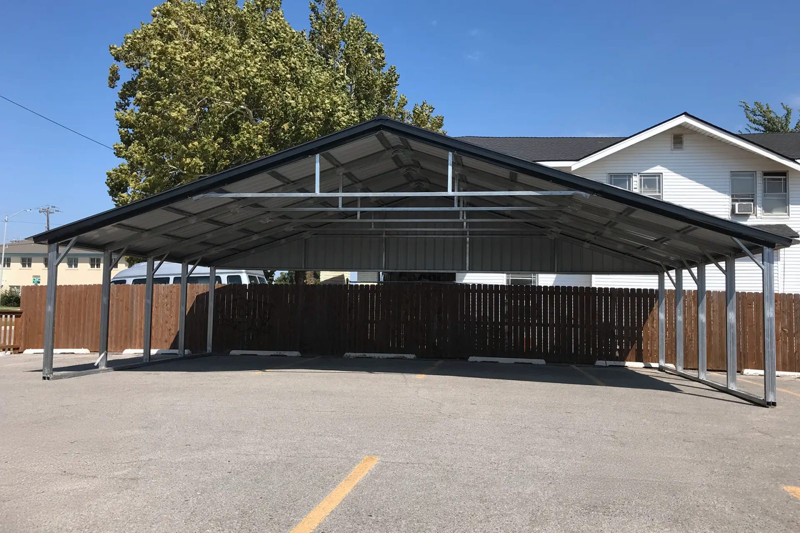 East TX Carports 3 car carport with black vertical roof