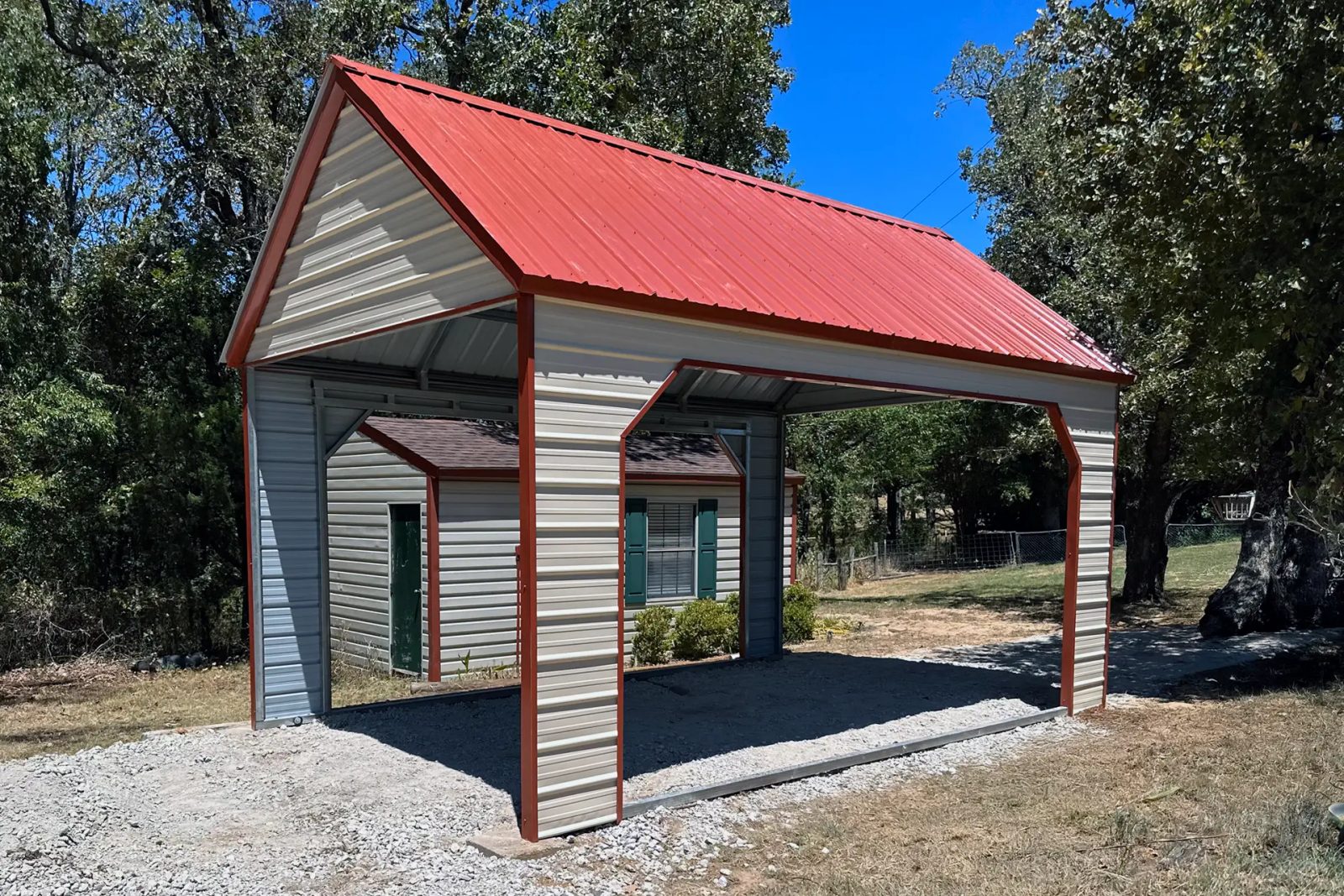 East TX Carports boat carport with red roof and beige siding