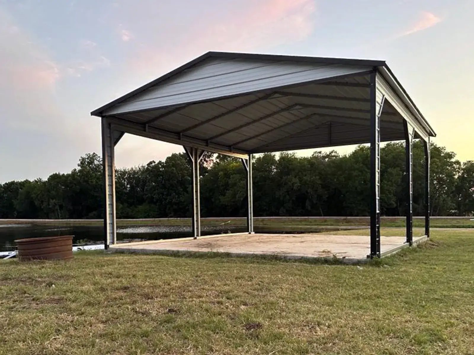 East TX Carports 2 car carport beside a lake at sunset